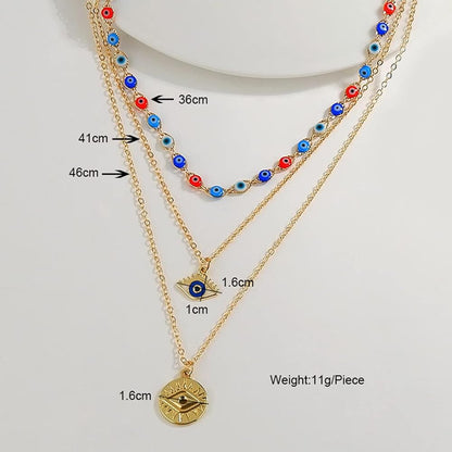 Dainty Layered Evil Eye Necklace Gold Plated stainless Steele with a Blue Eye Pendant and Multilayered and Adjustable Layering Choker Necklaces.